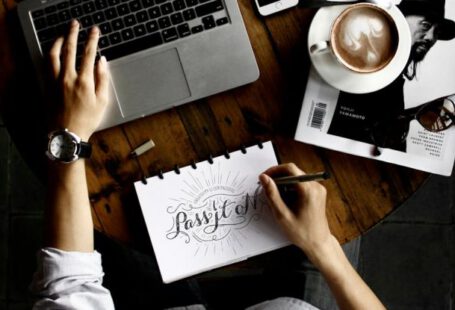 Designers - Person Sitting Facing Laptop Computer With Sketch Pad