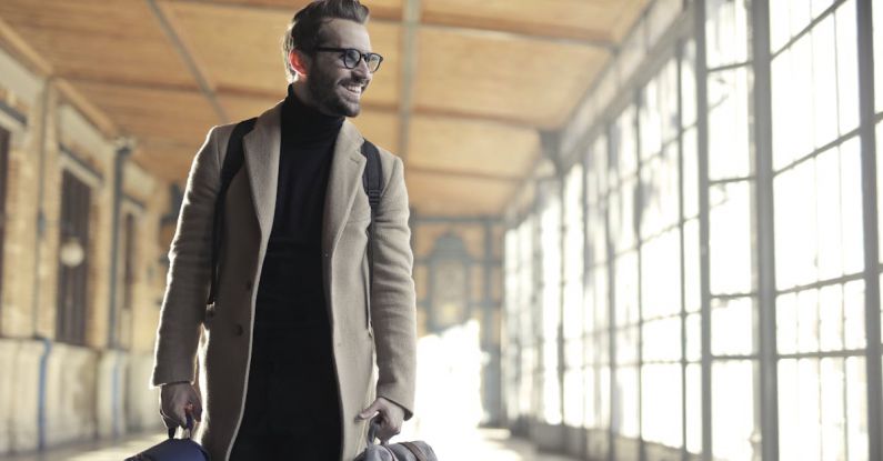 Business Trip - Man in Brown Robe Carrying Bag Smiling