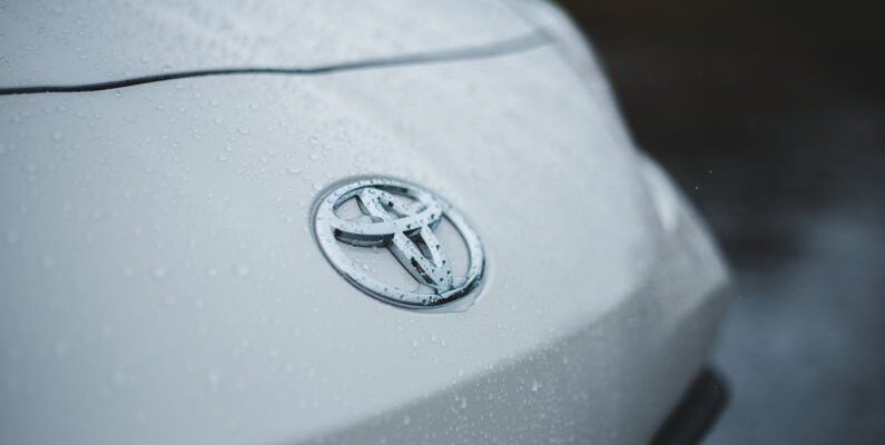 Fashion Icon - Shiny car with drops of rain