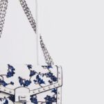 Handbags - White and Blue Floral Flap Sling Bag Hanging on White Steel Rack