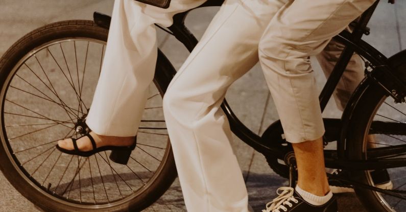 Office Attire - A Couple in Office Wear Riding a Bike