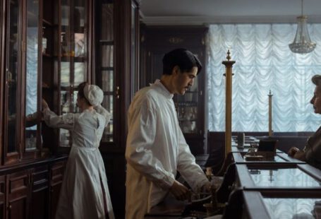 Buying Vintage - Man in White Laboratory Coat Standing in Front of an Elderly Woman