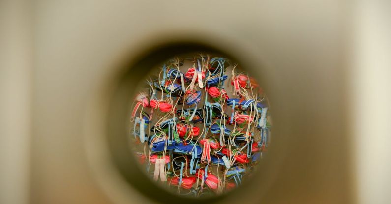 Multi-Purpose Items - Colorful Items seen through a Round Hole in a Surface