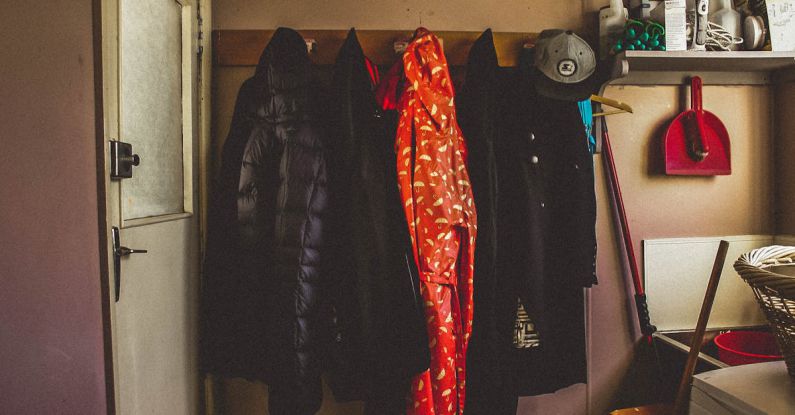 Coats - Hanged Black and Orange Coats Inside Room