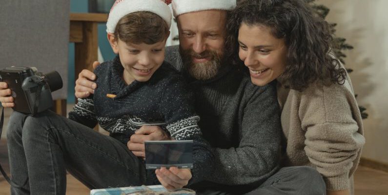 Tech Gifts - A Family Looking at a Photograph