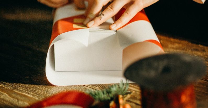 Gift Wrapping - Person Wrapping White Box