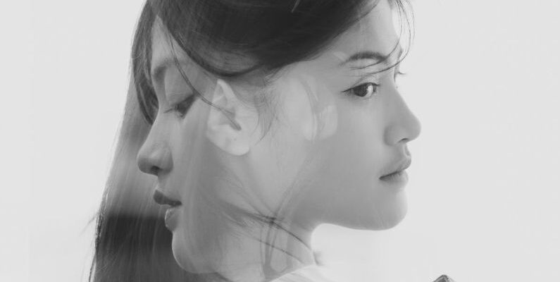 Layering - Black and White Double Exposure Portrait of a Young Beautiful Woman