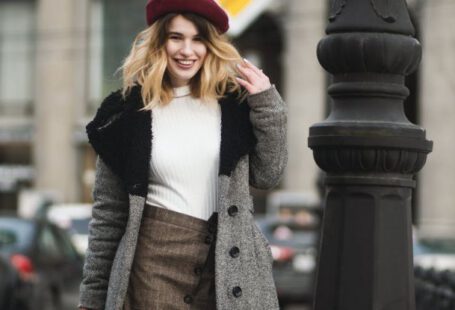 Chic Travel - Woman Standing Near Post